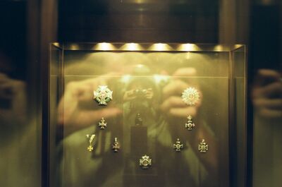 Jewelled orders and decorations behind reflective glass — Vienna, Austria (12-16 June 2000)