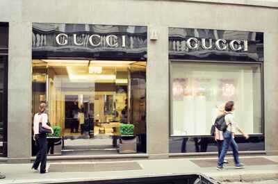 Pedestrians passing the Gucci storefront on Via Montenapoleone — Milan, Italy (12-16 June 2000)
