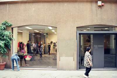 The Dolce & Gabbana shopfront with window shoppers — Milan, Italy (12-16 June 2000)