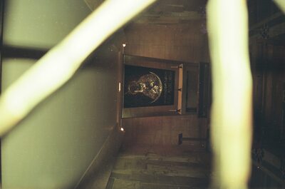 A golden icon glimpsed through metal railings — St Peter's Basilica, Vatican City (21-27 May 2000)