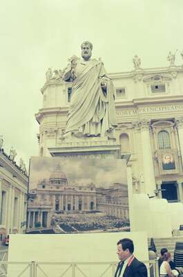 A marble apostle statue beside a giant Mass screen — St Peter's Basilica, Vatican City (21-27 May 2000)
