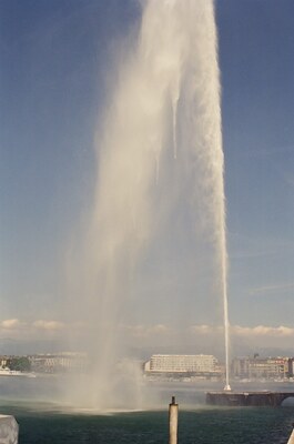 The Jet d'Eau plume drifting above the lakefront — Geneva, Switzerland (1-3 July 2000)