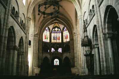 Stained glass and chandelier in a cathedral nave — Strasbourg, France (1-3 July 2000)