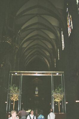 A glass display case in a dim cathedral interior — Strasbourg, France (1-3 July 2000)