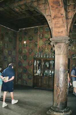 Richard reading beneath a painted ceiling at Chillon — Montreux, Switzerland (1 July 2000)