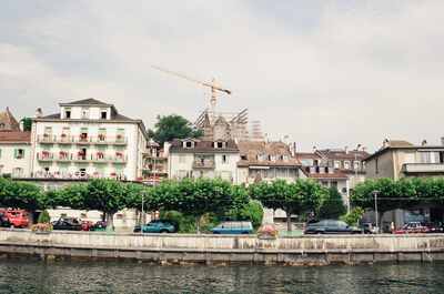 A lakefront hotel and town with a building crane — Montreux, Switzerland (1 July 2000)