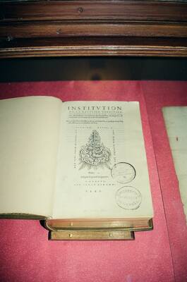 Calvin's Institutes open in a display case — Geneva, Switzerland (1 July 2000)