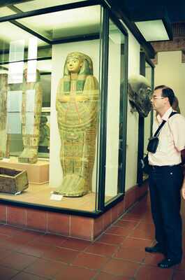 Richard examining a painted mummy case in a glass cabinet — Vatican Museums, Vatican City (21-27 May 2000)