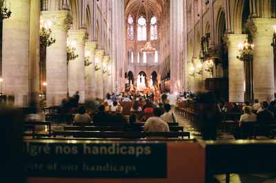 The nave of Notre-Dame with worshippers in the pews — Paris, France (22-28 June 2000)