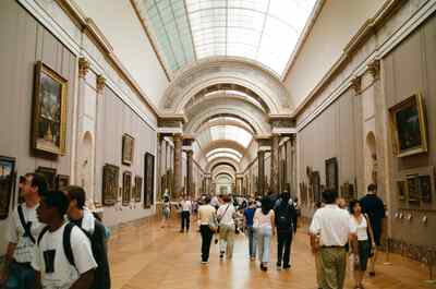The Grande Galerie crowded with visitors and paintings — Paris, France (22-28 June 2000)