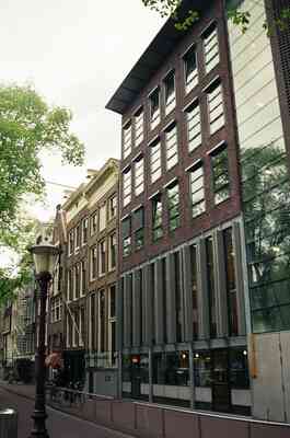 Brick buildings and a street lamp seen from below — Amsterdam, The Netherlands (19-26 June 2000)