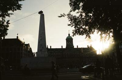 The National Monument obelisk silhouetted at sunset on Dam Square — Amsterdam, The Netherlands (19-26 June 2000)