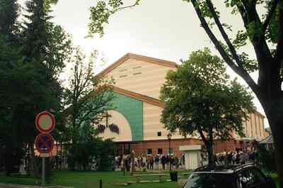The vast Passion Play Theatre building among trees — Oberammergau, Germany (19-26 June 2000)