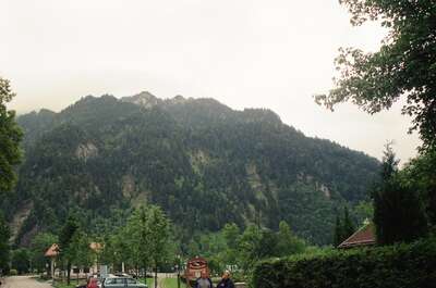 A forested mountain rising above the village — Oberammergau, Germany (19-26 June 2000)