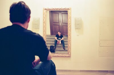 A man watching his reflection on a museum staircase — Vienna, Austria (14-16 June 2000)
