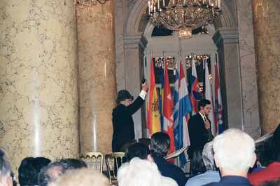 A costumed performer raises his hand on the concert stage — Vienna, Austria (14-16 June 2000)