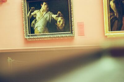 A David with Goliath's head painting on a pink gallery wall — Vienna, Austria (16-18 June 2000)