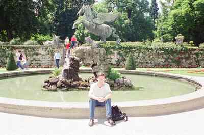 Richard sitting on the Pegasus fountain rim in the gardens — Salzburg, Austria (16-18 June 2000)