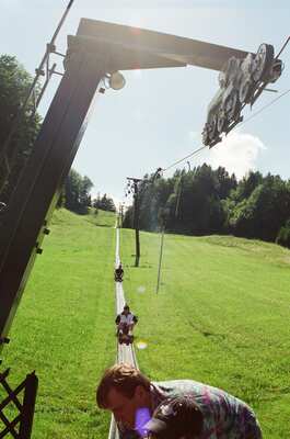 The summer toboggan run climbing a green hillside — Salzkammergut, Austria (16-18 June 2000)