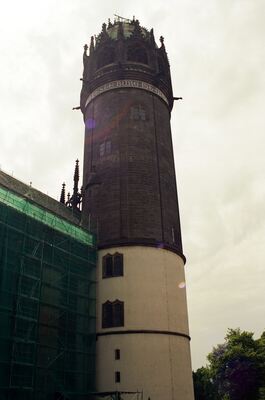 The round tower of the Schlosskirche under restoration netting — Wittenberg, Germany (22 June 2000)