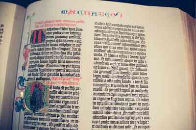 Open Gutenberg Bible page in a display case — Wittenberg, Germany (22 June 2000)