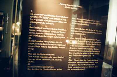 Backlit panel of Luther's 95 Theses excerpts — Wittenberg, Germany (22 June 2000)