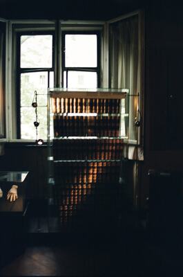 Sunlit museum room with shelves of historic books — Wittenberg, Germany (22 June 2000)