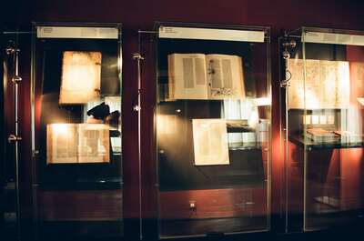 Glass cases displaying open historic printed Bibles — Wittenberg, Germany (22 June 2000)