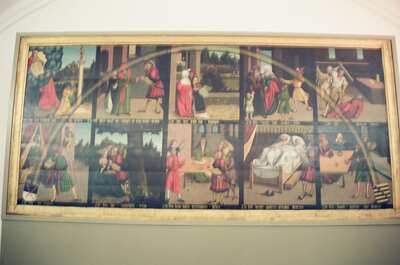Cranach painted panel with biblical scenes on a wall — Wittenberg, Germany (22 June 2000)