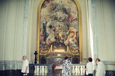 Visitors before a baroque altarpiece painting — Rome, Italy (late May 2000)