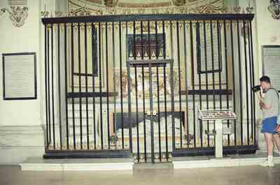 Iron-grilled chapel with a man filming the altar — Rome, Italy (late May 2000)