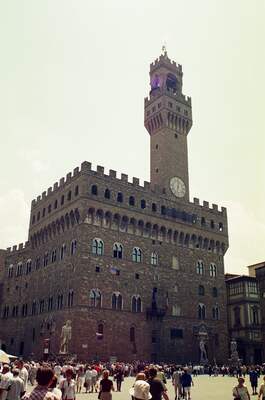 The Palazzo Vecchio tower above a crowded piazza — Florence, Italy (26 May 2000)