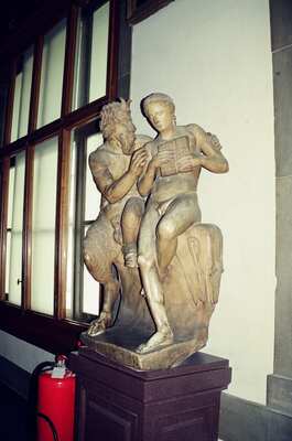 Marble sculpture group beside windowed gallery wall — Florence, Italy (26 May 2000)