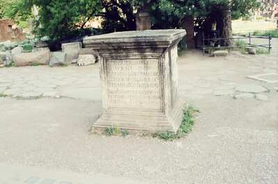 An inscribed marble pedestal among scattered ruins in the Forum — Rome, Italy (21-27 May 2000)
