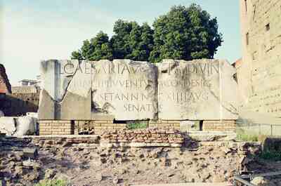 A large inscribed marble block on a brick base — Rome, Italy (21-27 May 2000)