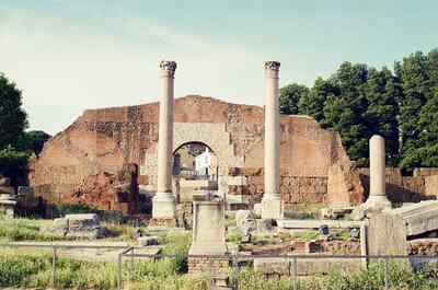 Two slender columns and an arched brick ruin — Rome, Italy (21-27 May 2000)