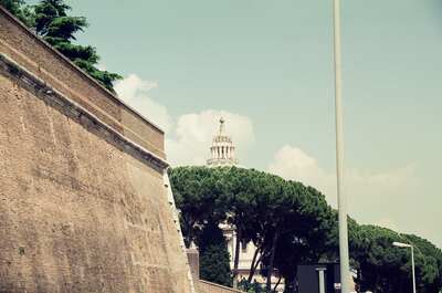 St Peter's dome peeking over the high Vatican wall — St Peter's Basilica, Vatican City (21-27 May 2000)