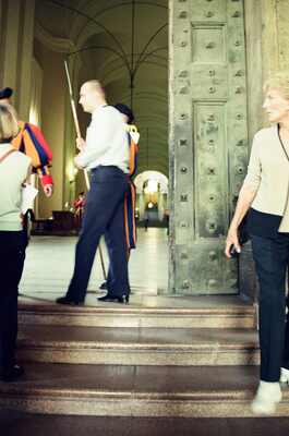 A Swiss Guard at the basilica's bronze entrance doors — St Peter's Basilica, Vatican City (21-27 May 2000)