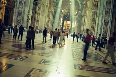 Sunlight streaming across the nave toward the baldachin — St Peter's Basilica, Vatican City (21-27 May 2000)