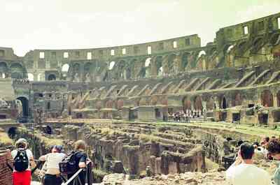 Visitors gazing into the ruined arena of the Colosseum — Rome, Italy (21-27 May 2000)
