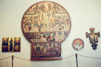 Medieval round panel painting and icons on a wall — Vatican Museums, Vatican City (21-27 May 2000)