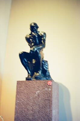 A dark abstract sculpture on a stone plinth — Vatican Museums, Vatican City (21-27 May 2000)