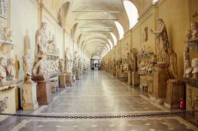 A long hall lined with marble busts and statues — Vatican Museums, Vatican City (21-27 May 2000)