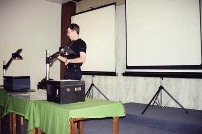 Richard giving a talk at an overhead projector — SW Italy, Italy (28 May - 3 June 2000)