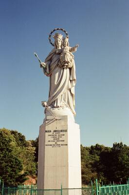 A hilltop marble Madonna statue against blue sky — Gaeta & the coast, Italy (28 May - 3 June 2000)
