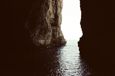 A towering sea cliff framing the open water — Gaeta & the coast, Italy (28 May - 3 June 2000)
