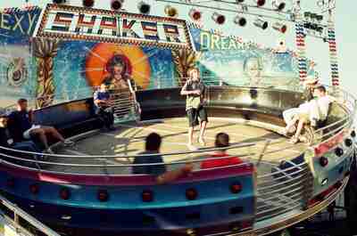 Children on a spinning ride at a seaside funfair — SW Italy coast, Italy (28 May - 3 June 2000)