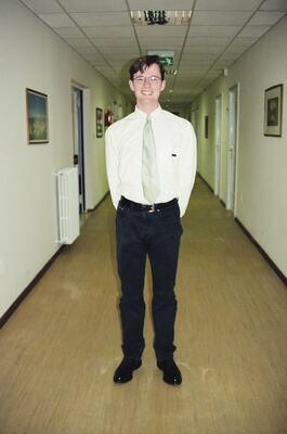 Richard standing in a conference venue corridor — SW Italy, Italy (28 May - 3 June 2000)