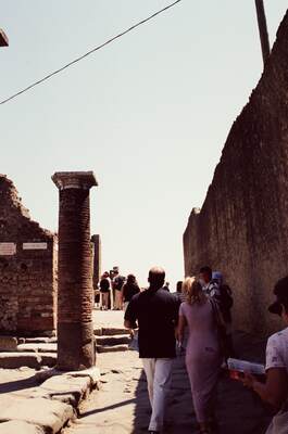 A standing column and visitors in the forum — Pompeii, Italy (28 May - 3 June 2000)