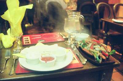 Steaming fajitas served at a candlelit restaurant table — Ireland, Ireland (4-9 July 2000)